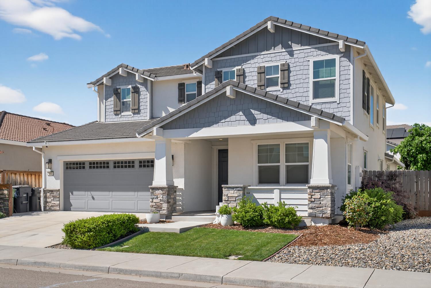 183 Michael Cox Lane Tracy, CA 95377 - Photo 2 of 35 a front view of a house with a yard