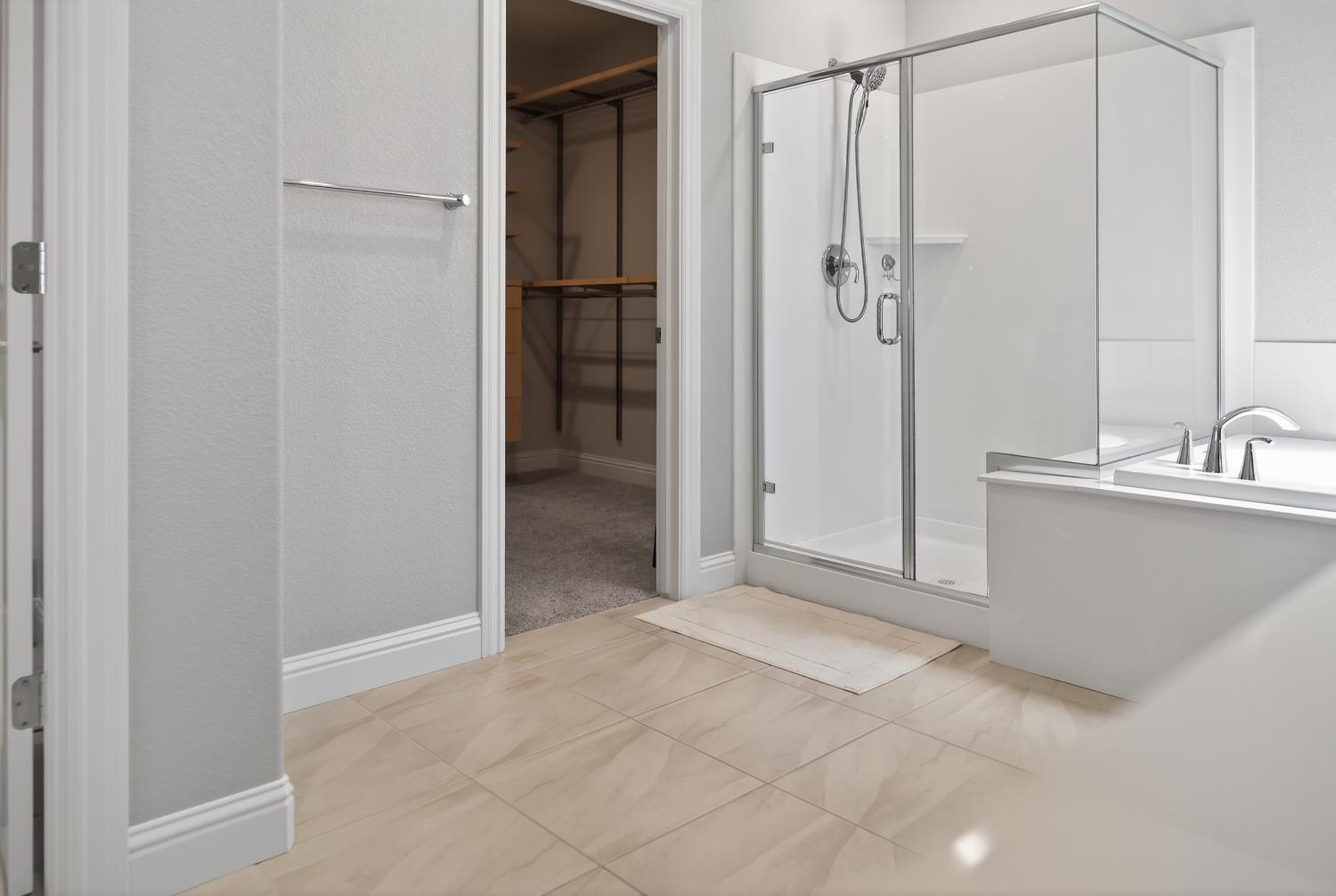 183 Michael Cox Lane Tracy, CA 95377 - Photo 21 of 35 a view of bathroom with a shower and closet