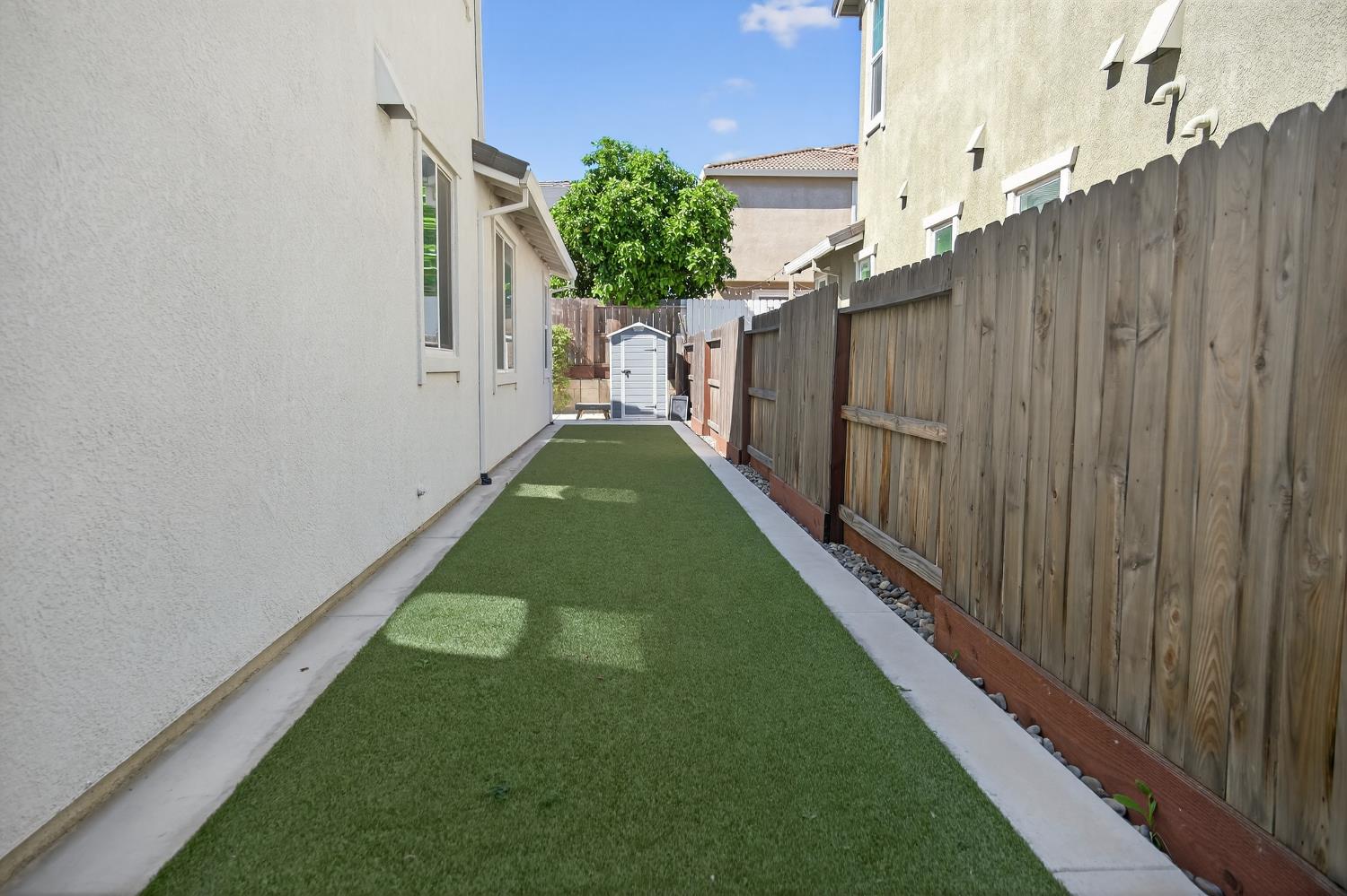 183 Michael Cox Lane Tracy, CA 95377 - Photo 33 of 35 a view of a backyard with wooden fence