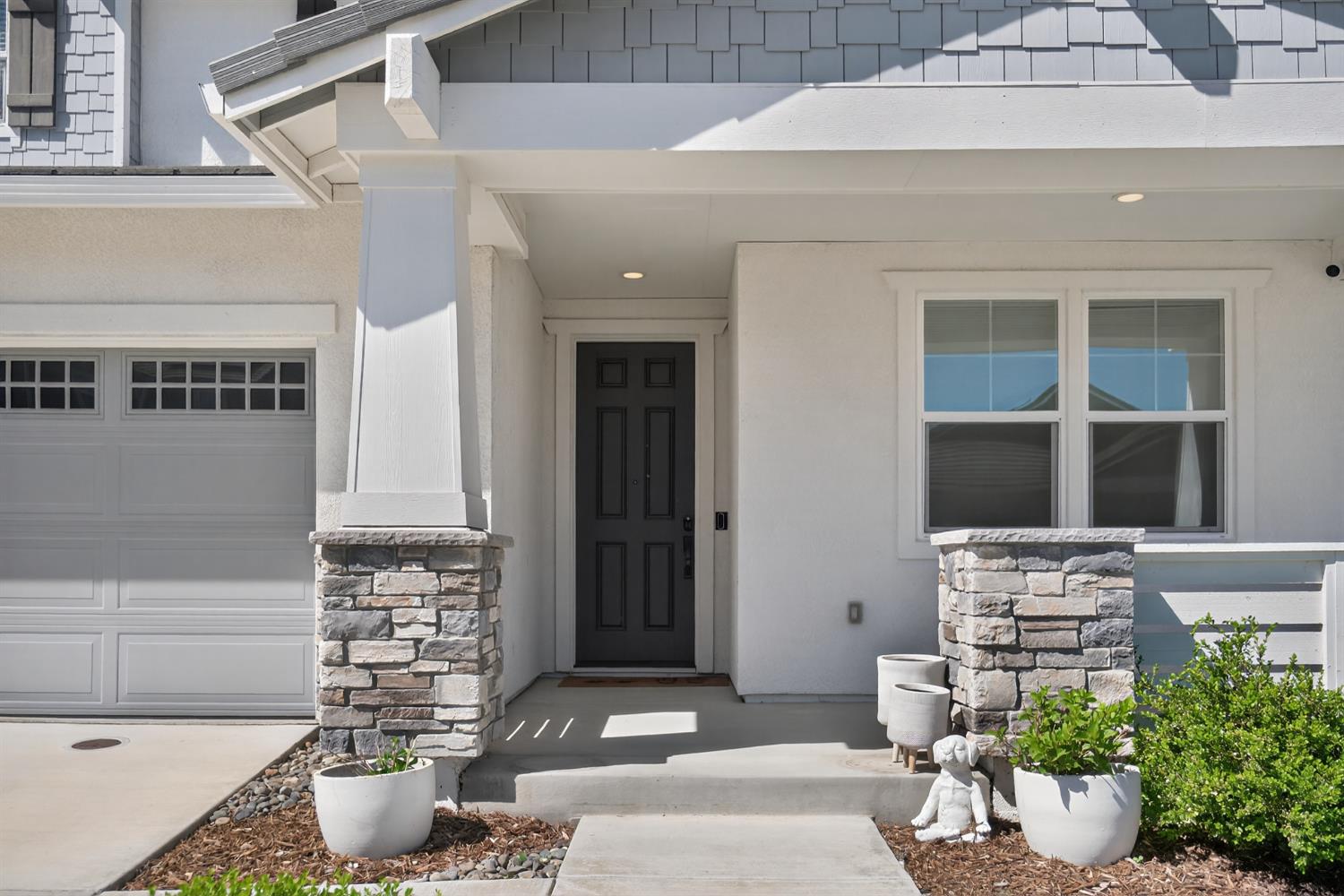 183 Michael Cox Lane Tracy, CA 95377 - Photo 4 of 35 a potted plant sitting in front of a house