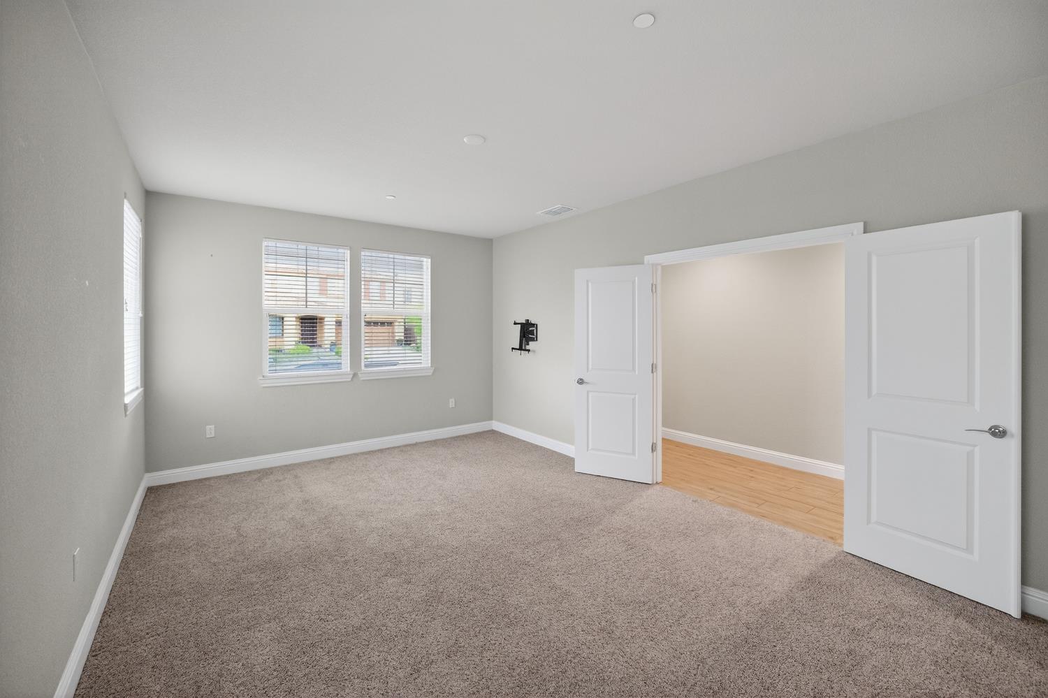 183 Michael Cox Lane Tracy, CA 95377 - Photo 7 of 35 a view of an empty room with a window