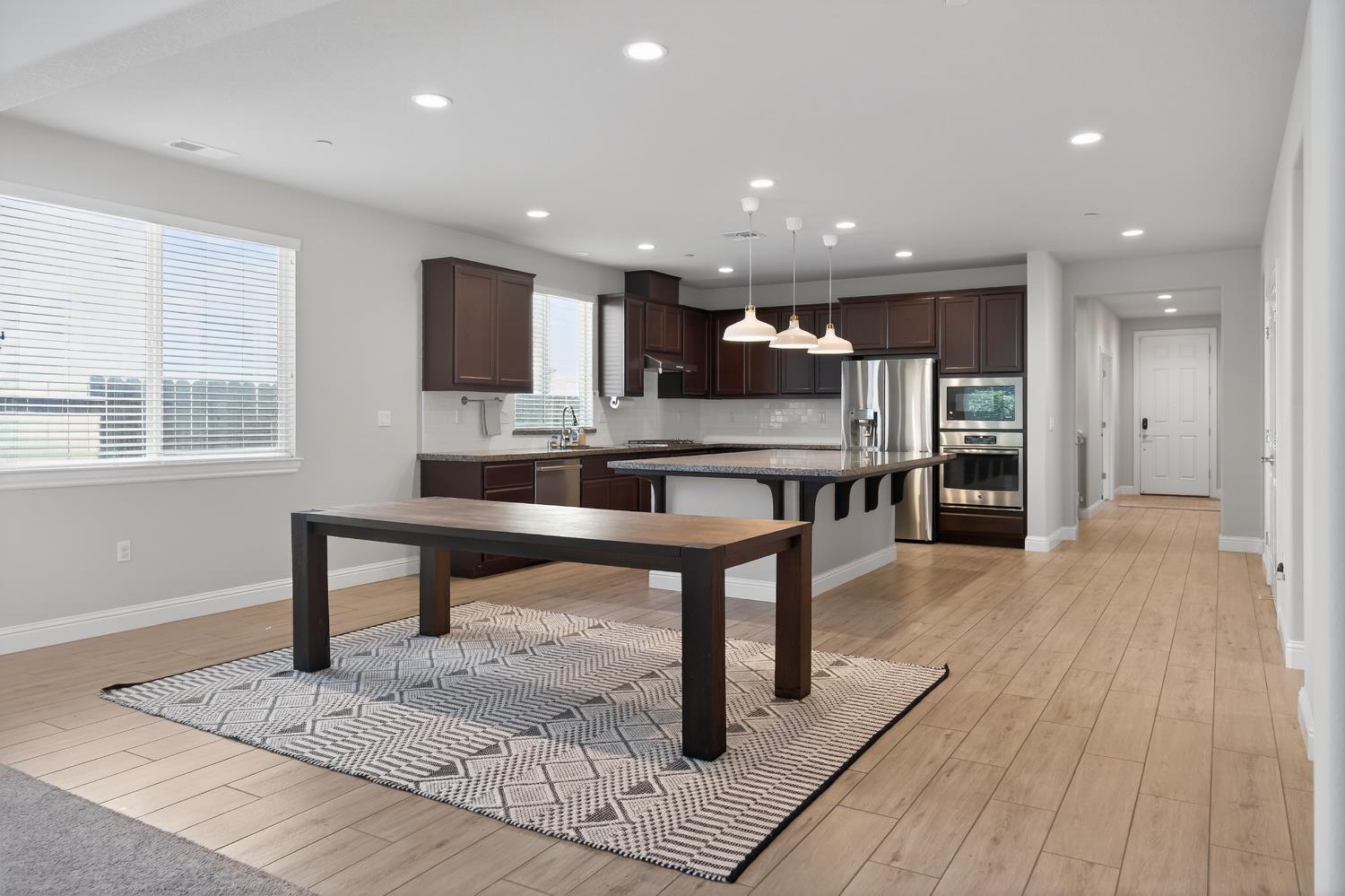 183 Michael Cox Lane Tracy, CA 95377 - Photo 8 of 35 a view of kitchen with cabinets and wooden floor