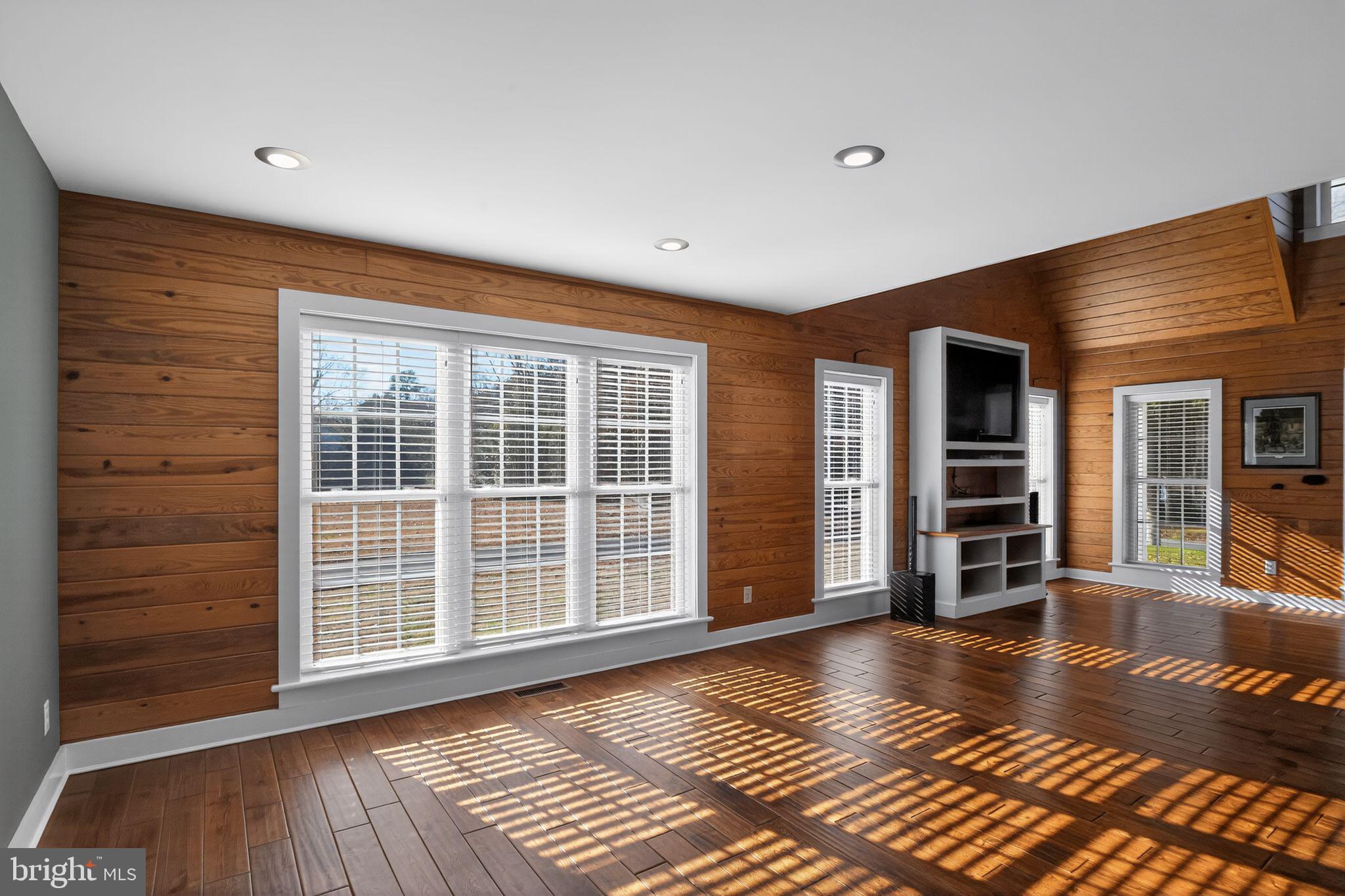6857 Fire Tower Road Hebron, MD 21830 - Photo 11 of 30 a view of an empty room with wooden floor and a window