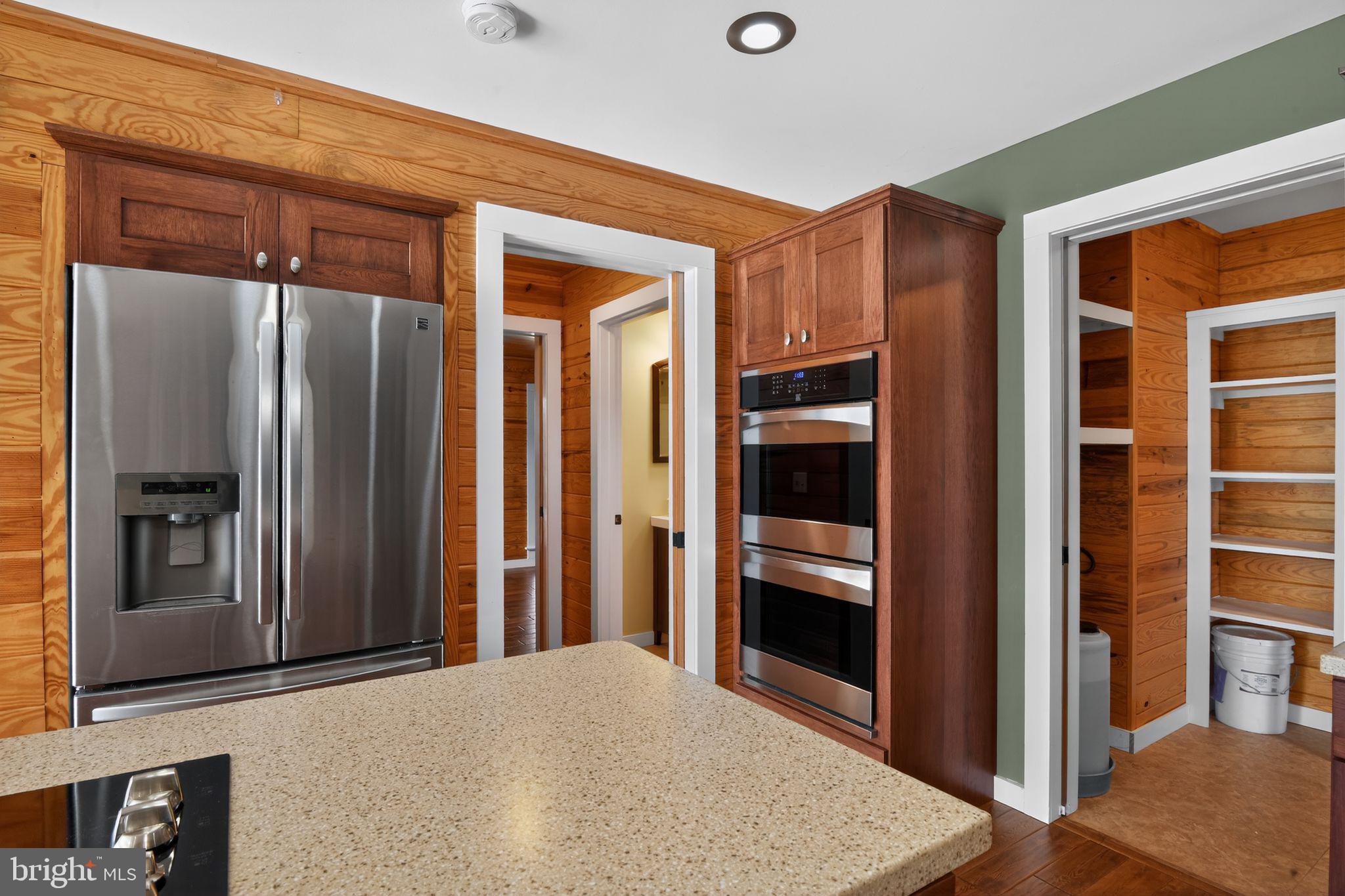 6857 Fire Tower Road Hebron, MD 21830 - Photo 13 of 30 a view of a hallway with wooden shelves