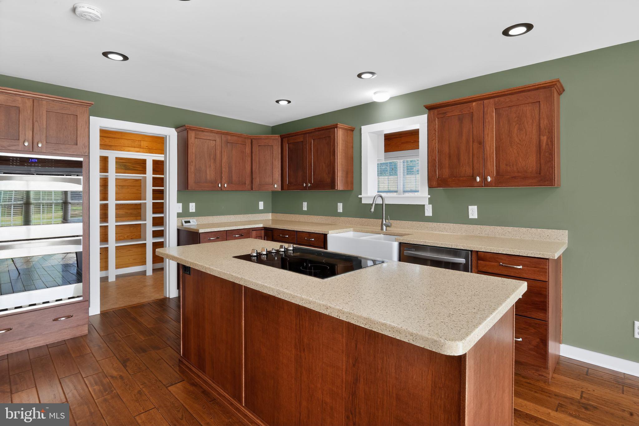 6857 Fire Tower Road Hebron, MD 21830 - Photo 15 of 30 a kitchen with a stove a sink and a microwave