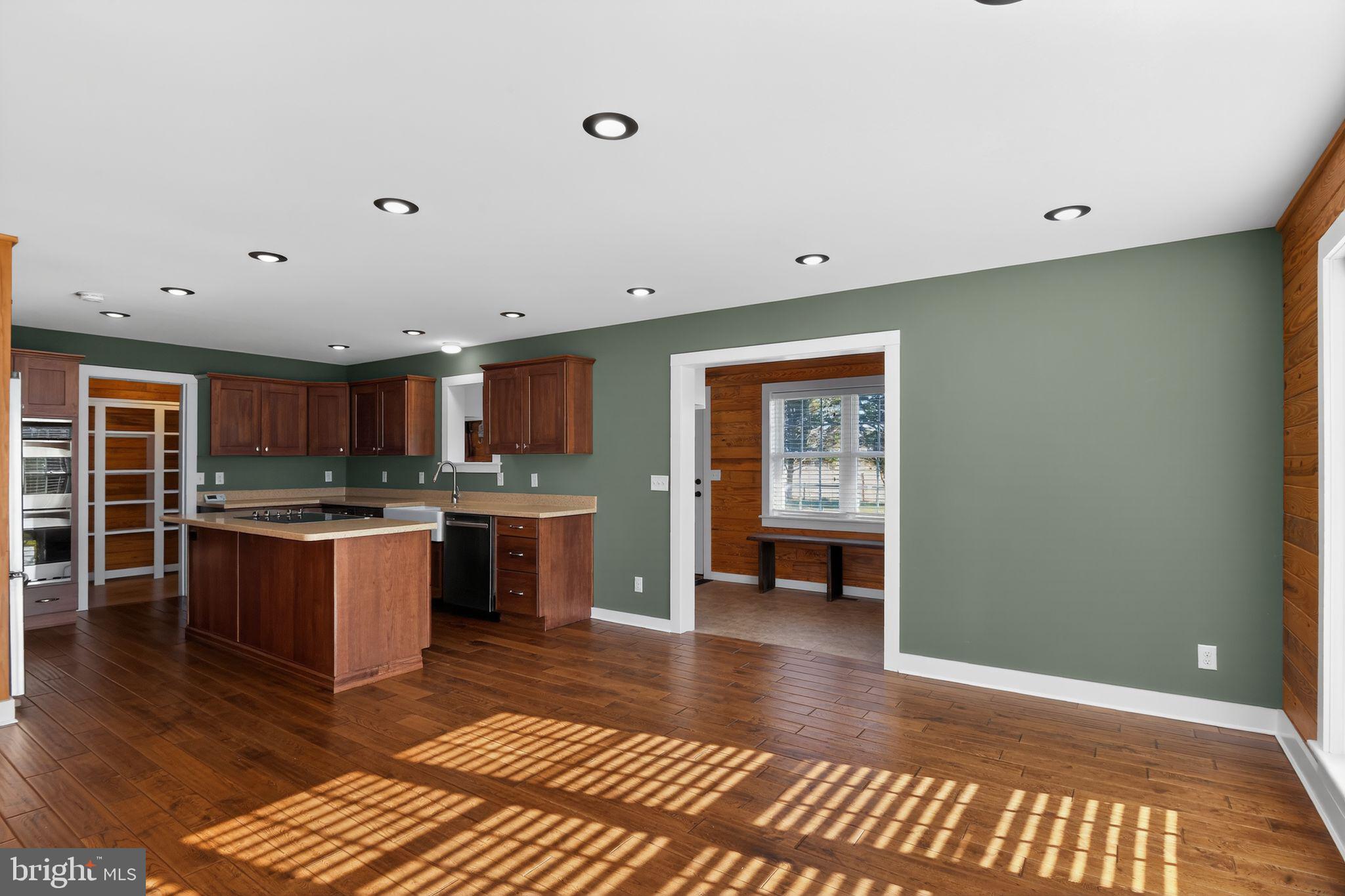 6857 Fire Tower Road Hebron, MD 21830 - Photo 16 of 30 a kitchen with stainless steel appliances granite countertop a stove a sink and a refrigerator