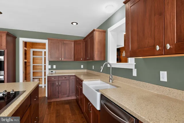 a kitchen with a sink and cabinets