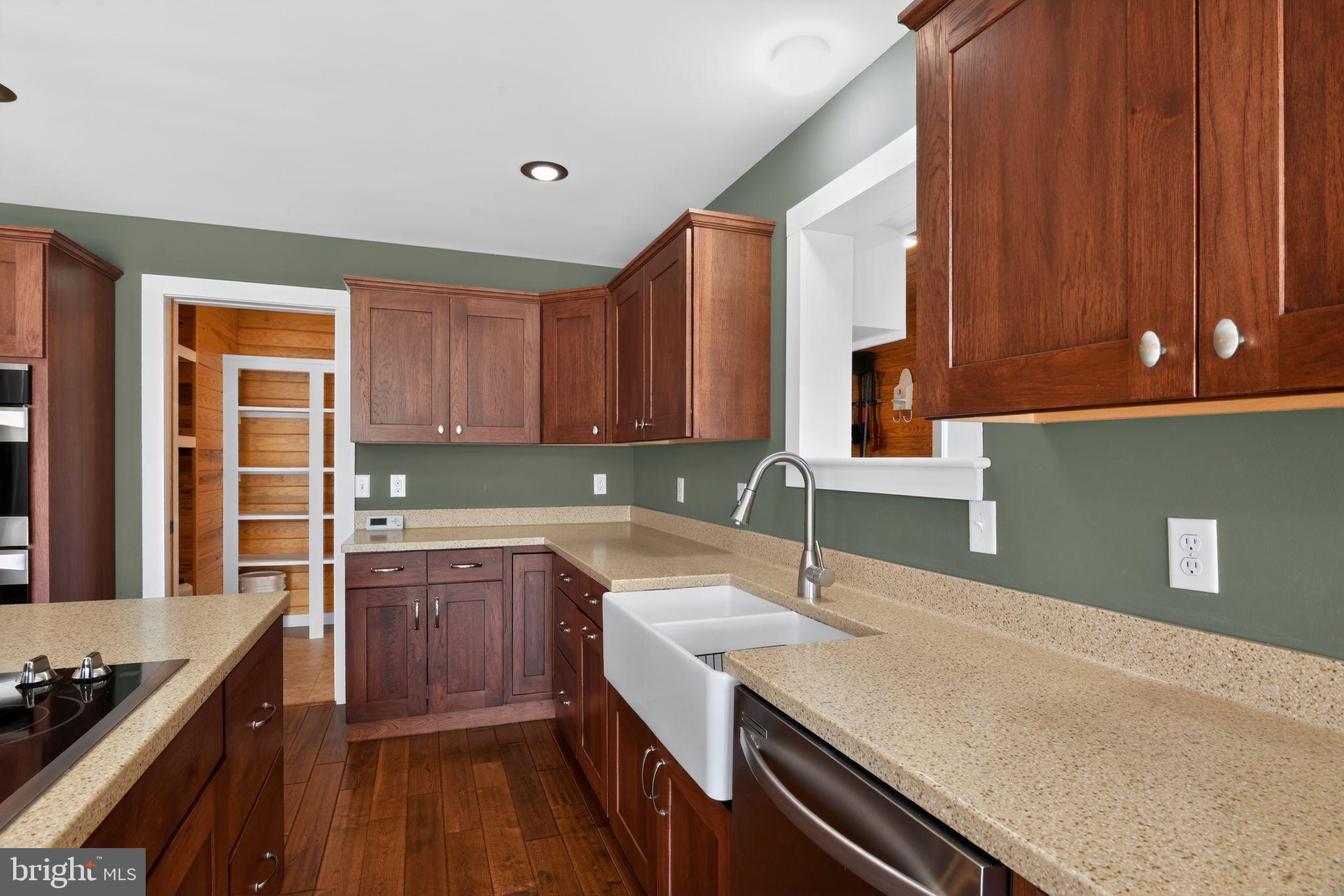 6857 Fire Tower Road Hebron, MD 21830 - Photo 17 of 30 a kitchen with a sink and cabinets