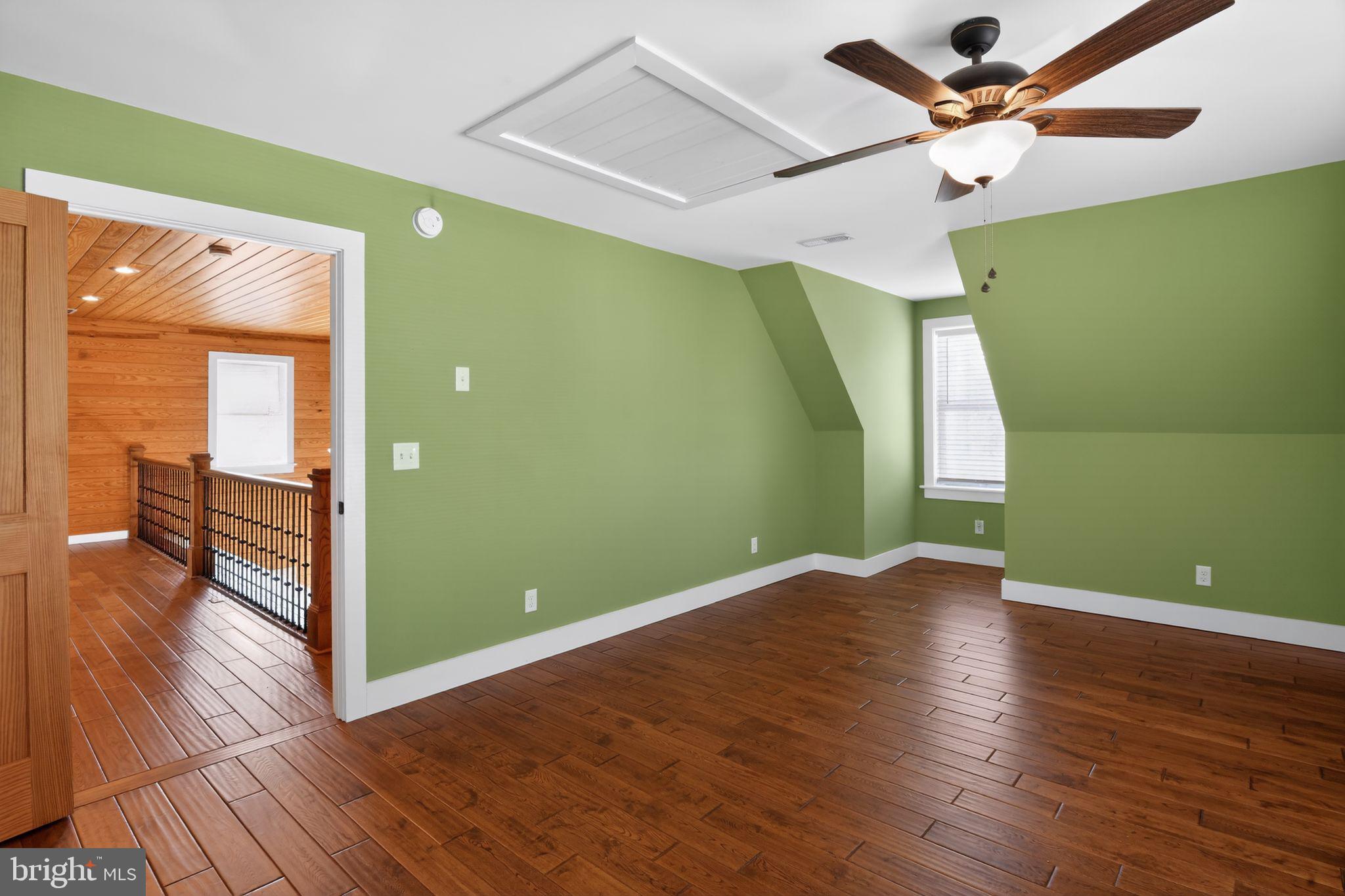 6857 Fire Tower Road Hebron, MD 21830 - Photo 22 of 30 wooden floor in an empty room with a window