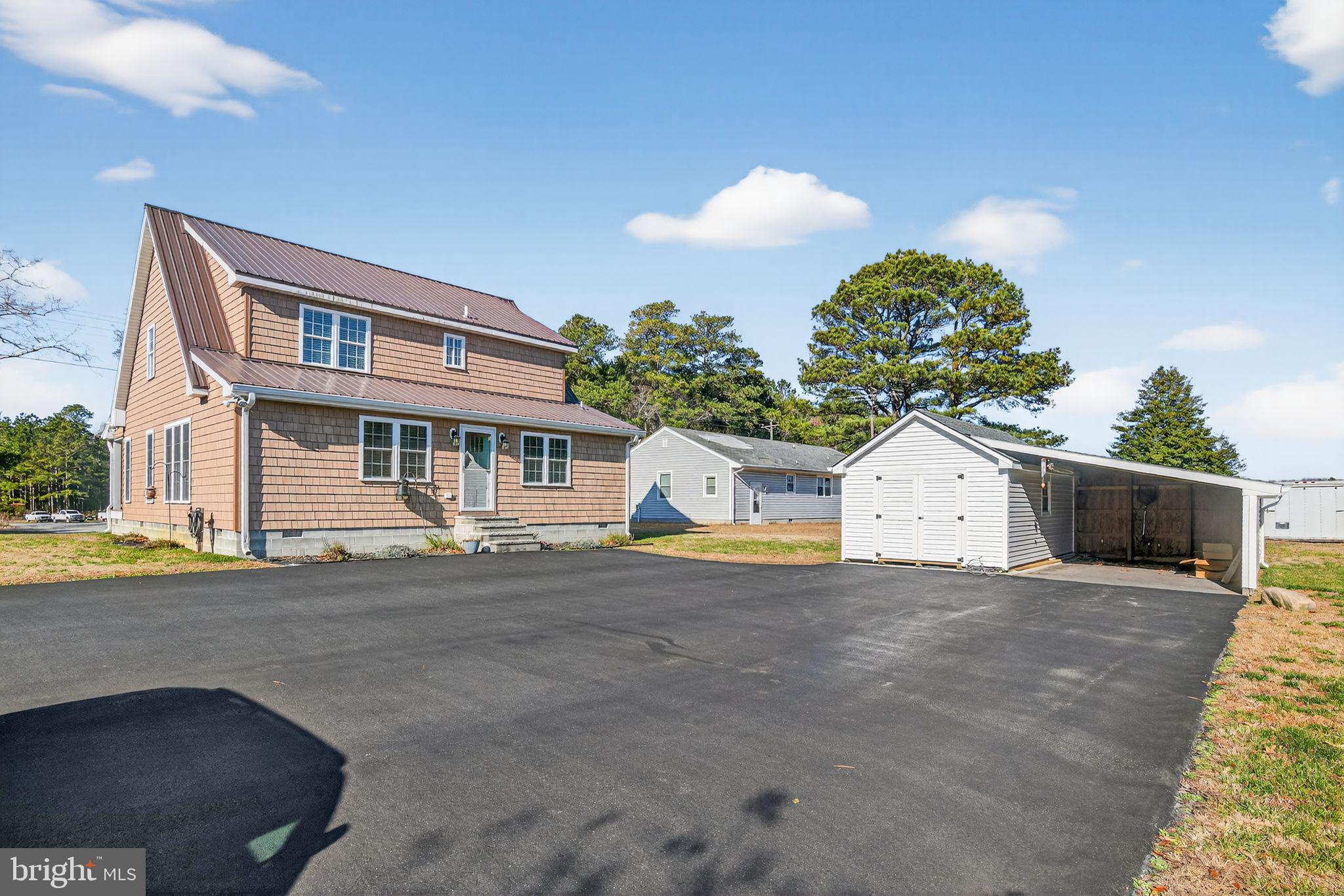 6857 Fire Tower Road Hebron, MD 21830 - Photo 3 of 30 a view of a house with a yard