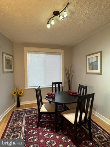 a stove top oven sitting inside of a kitchen