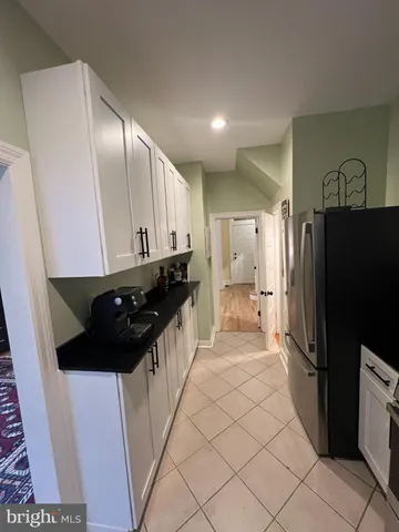 a kitchen with stainless steel appliances a refrigerator and a stove