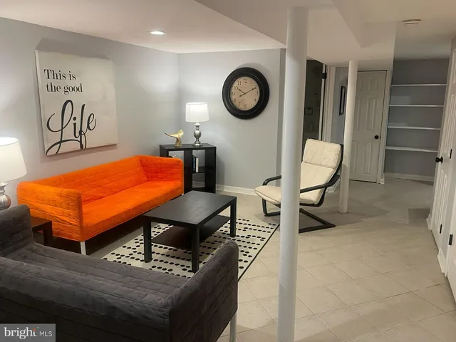 a view of a backyard with sitting area