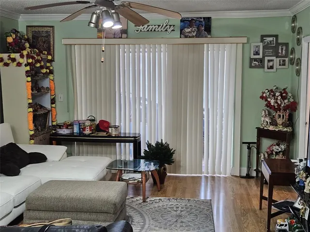 a view of a city from a living room filled with furniture