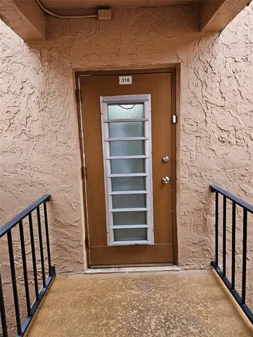 a view of a hallway view with staircase