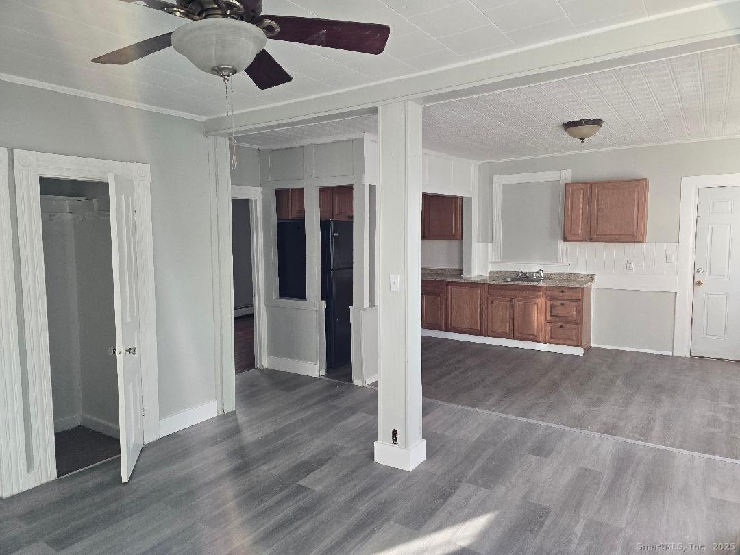 133 South Street, Unit 1 Waterbury, CT 06706 - Photo 2 of 6 a view interior of a house wooden floor and cabinet