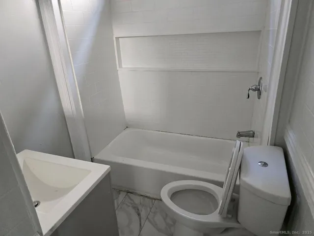 a bathroom with a sink and toilet