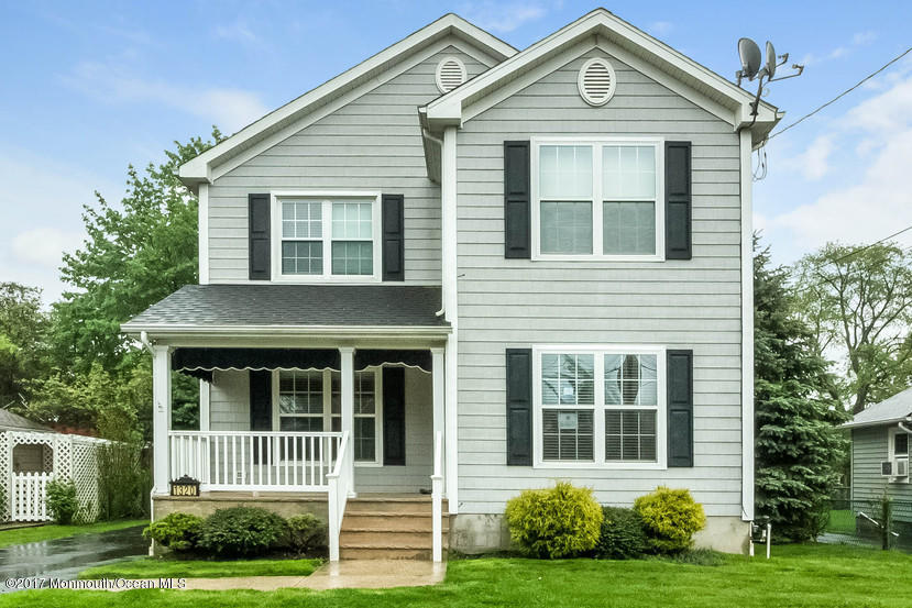 1320 Squirrel Road Wall, NJ 07719 - Photo 1 of 24 a front view of a house with a yard