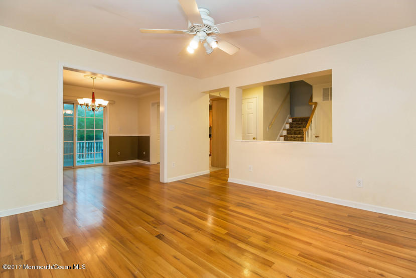 1320 Squirrel Road Wall, NJ 07719 - Photo 11 of 24 a view of an empty room with window and wooden floor