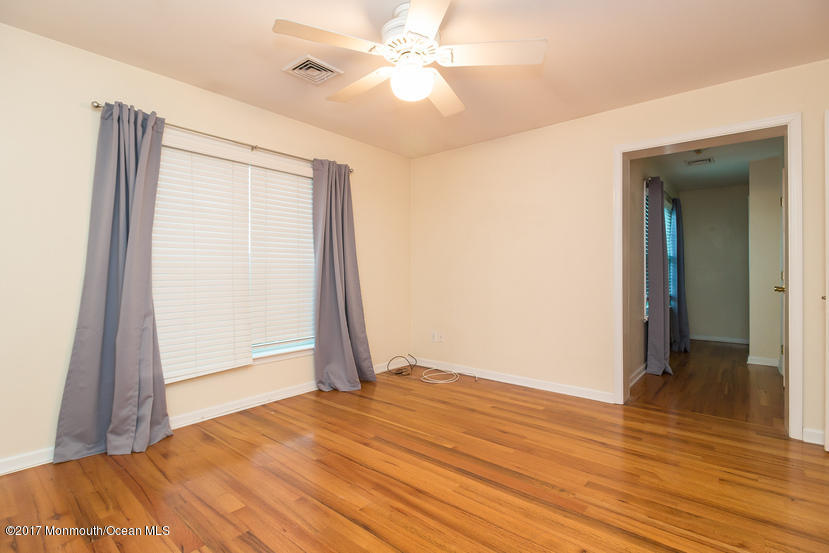 1320 Squirrel Road Wall, NJ 07719 - Photo 13 of 24 a view of empty room with wooden floor