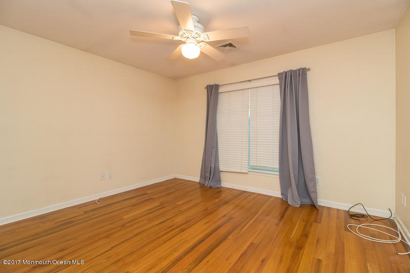 1320 Squirrel Road Wall, NJ 07719 - Photo 15 of 24 wooden floor in an empty room