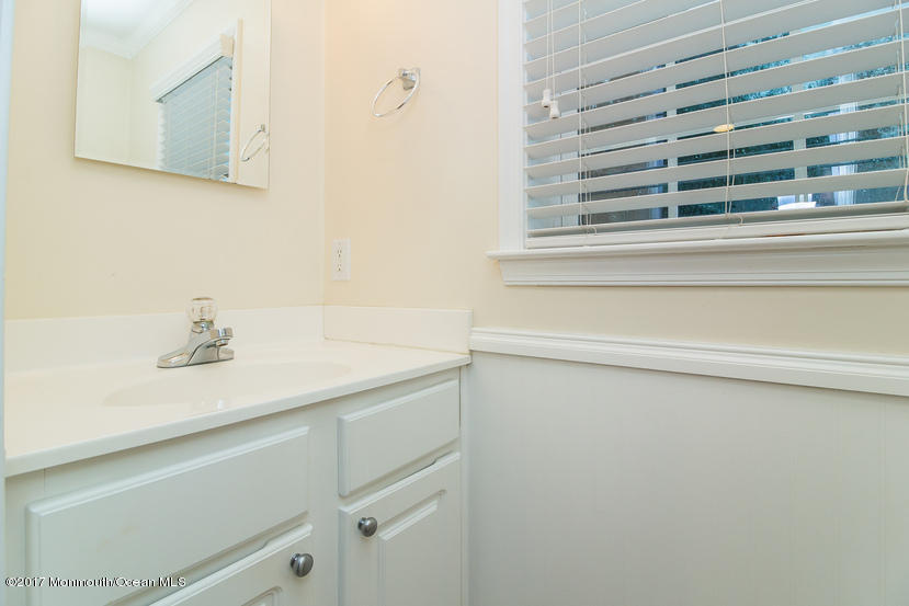 1320 Squirrel Road Wall, NJ 07719 - Photo 18 of 24 a bathroom with a sink and a bathtub
