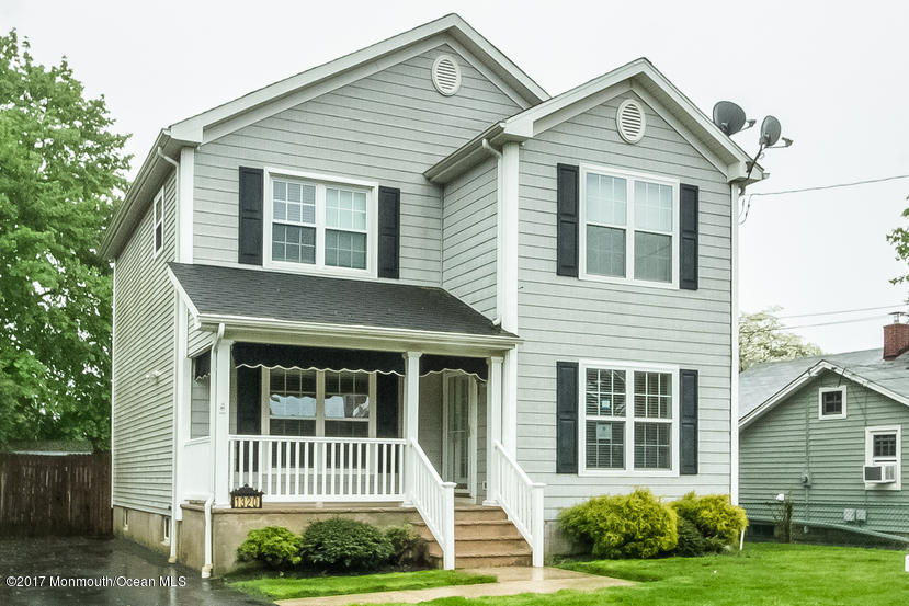 1320 Squirrel Road Wall, NJ 07719 - Photo 2 of 24 a front view of a house with a yard