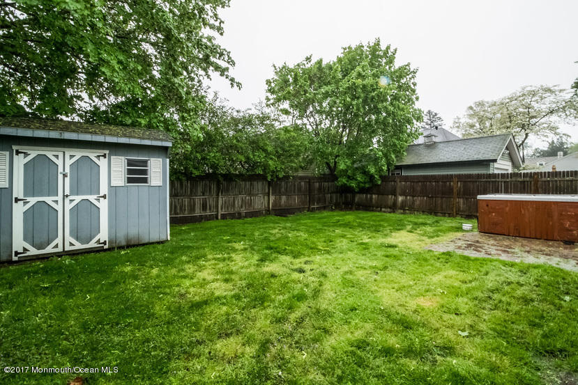 1320 Squirrel Road Wall, NJ 07719 - Photo 21 of 24 a backyard of a house with table and sofas
