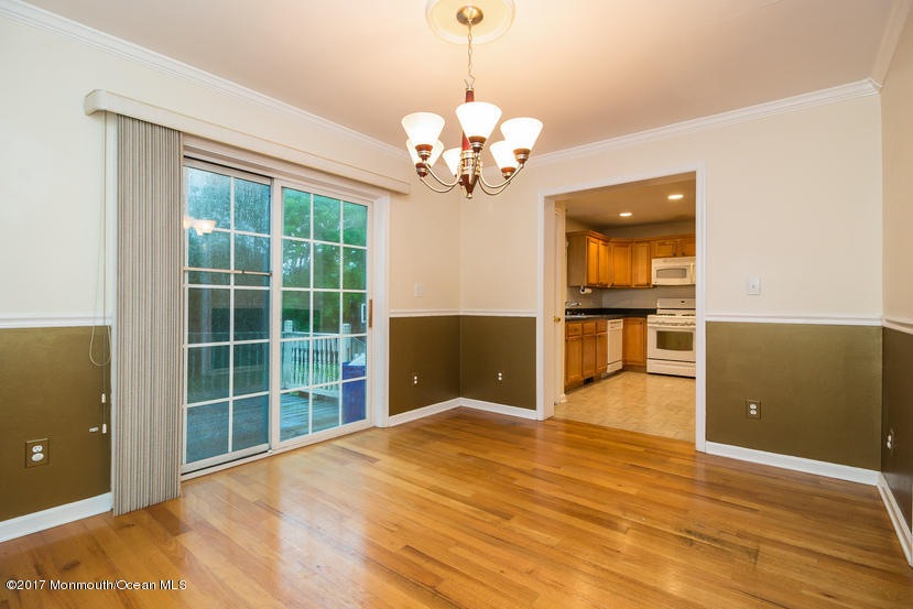 1320 Squirrel Road Wall, NJ 07719 - Photo 6 of 24 a view of a livingroom with a chandelier