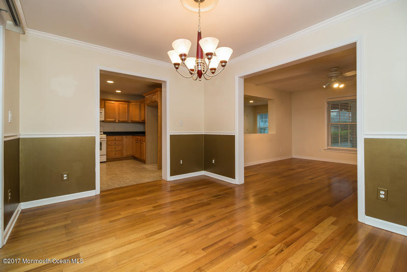 1320 Squirrel Road Wall, NJ 07719 - Photo 7 of 24 a view of a livingroom with a chandelier