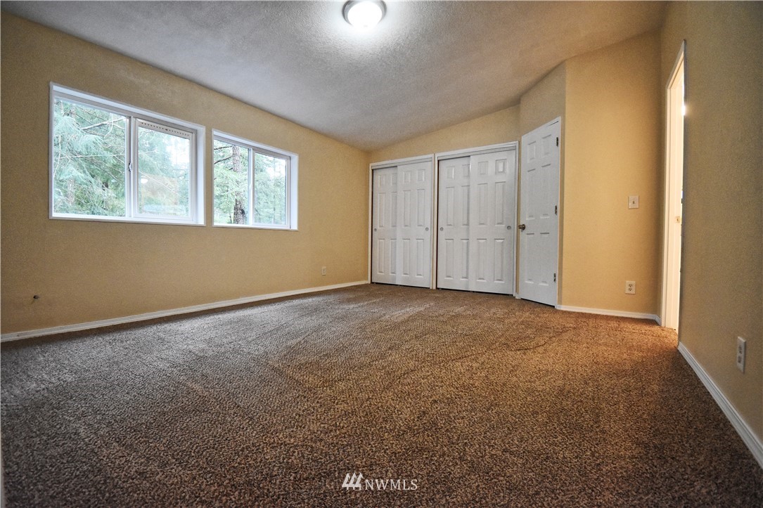 111 East Sleaford Road Shelton, WA 98584 - Photo 11 of 32 a view of an empty room with a window