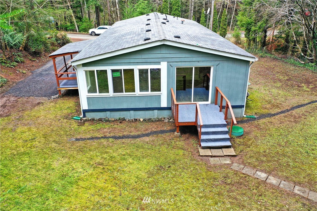 111 East Sleaford Road Shelton, WA 98584 - Photo 2 of 32 a house with trees in the background