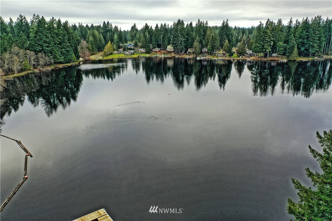 111 East Sleaford Road Shelton, WA 98584 - Photo 25 of 32 a view of a lake with boats and trees in the background