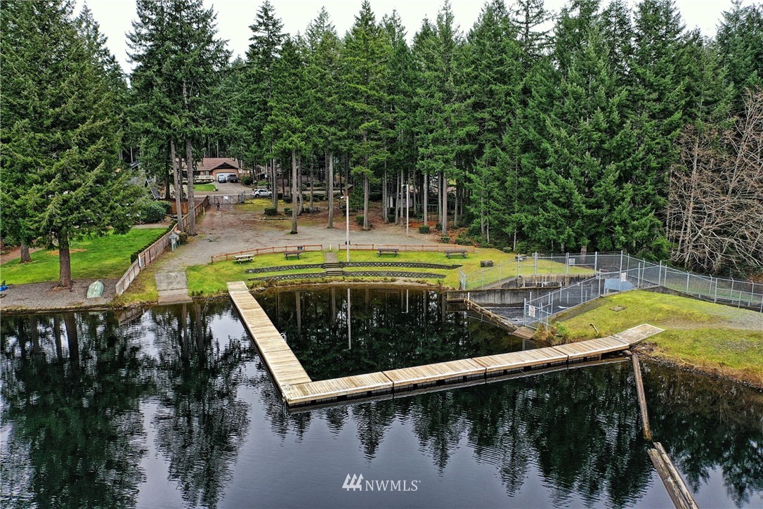 111 East Sleaford Road Shelton, WA 98584 - Photo 31 of 32 a view of a swimming pool with a patio and a yard with lake view