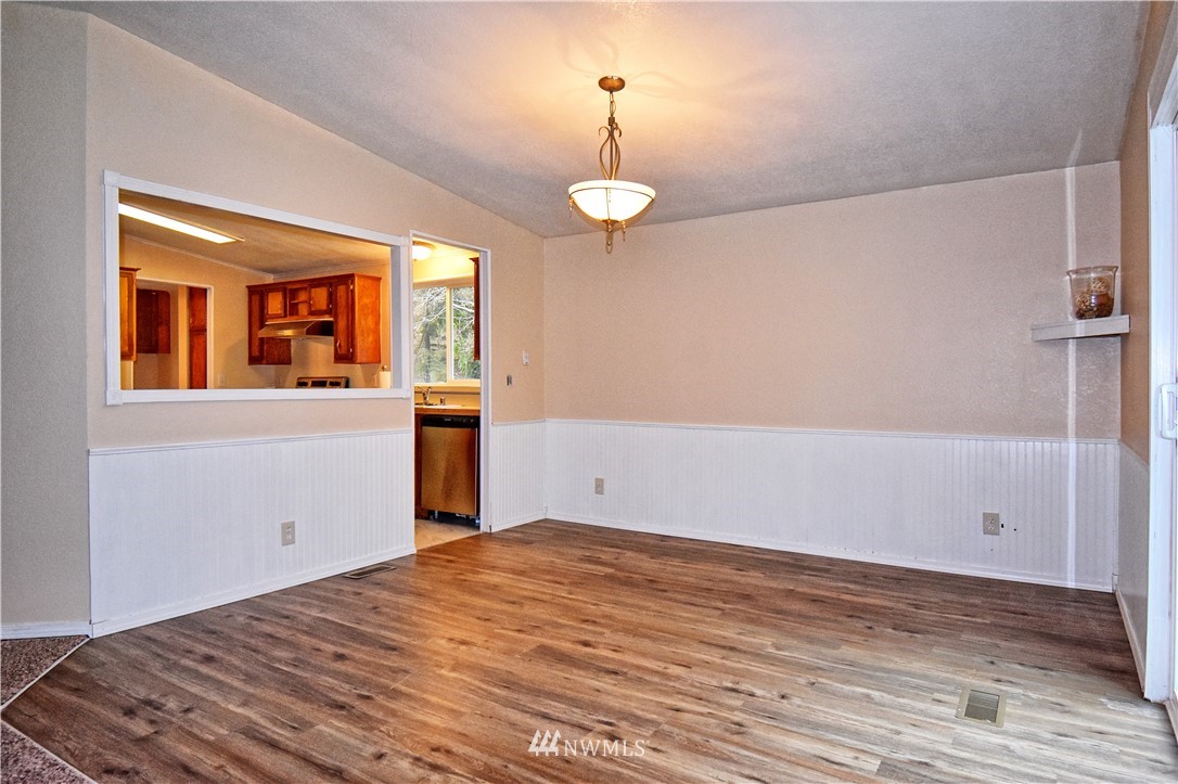 111 East Sleaford Road Shelton, WA 98584 - Photo 10 of 32 a view of a room with wooden floor and window