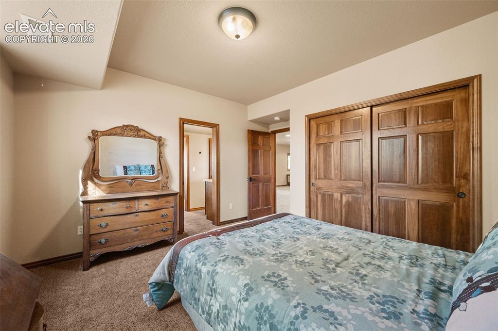 131 Paradiso Road Divide, CO 80814 - Photo 33 of 50 a bedroom with a bed and a dresser