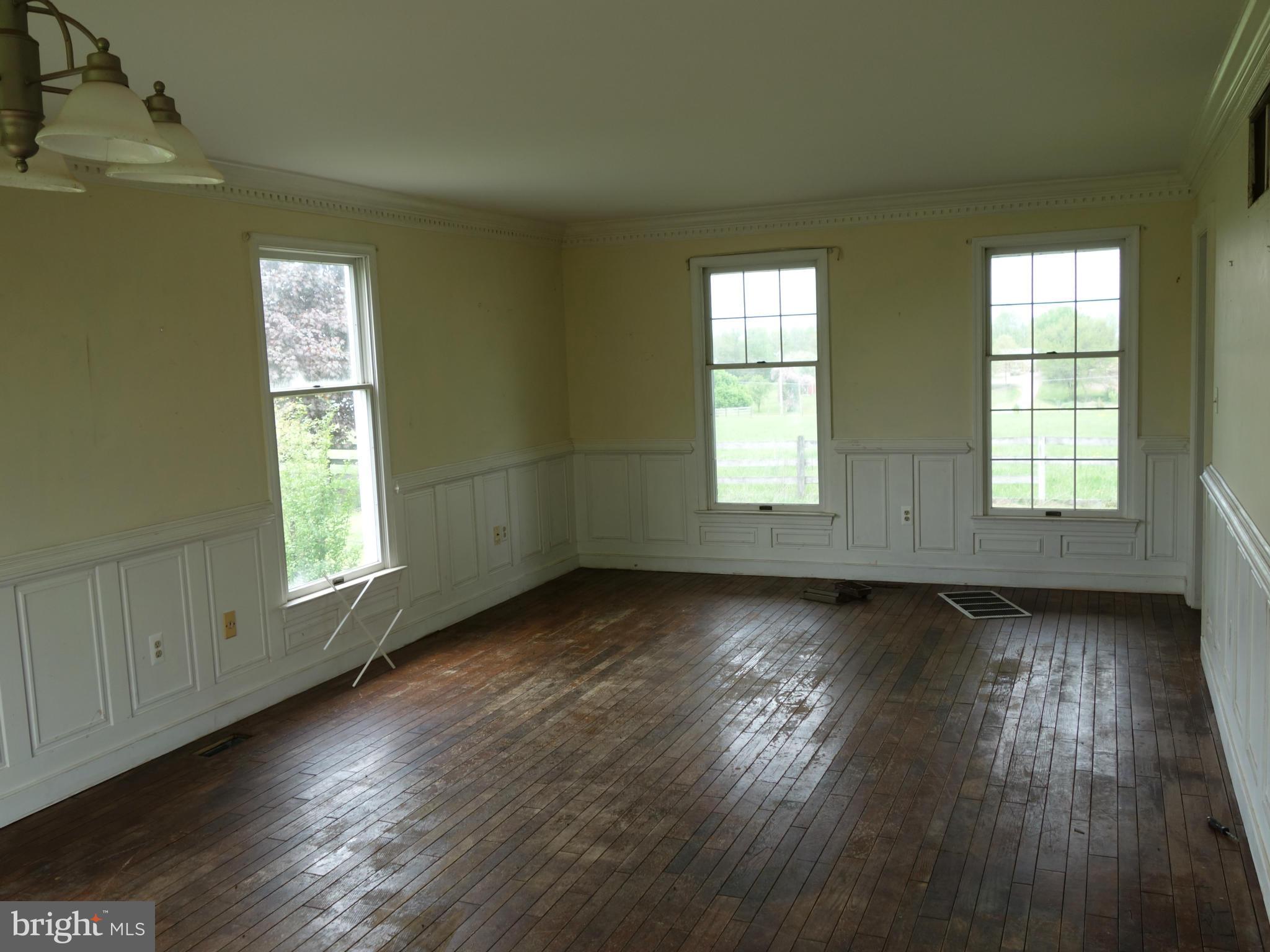 7235 Keysville Road Keymar, MD 21757 - Photo 6 of 21 an empty room with wooden floor and windows
