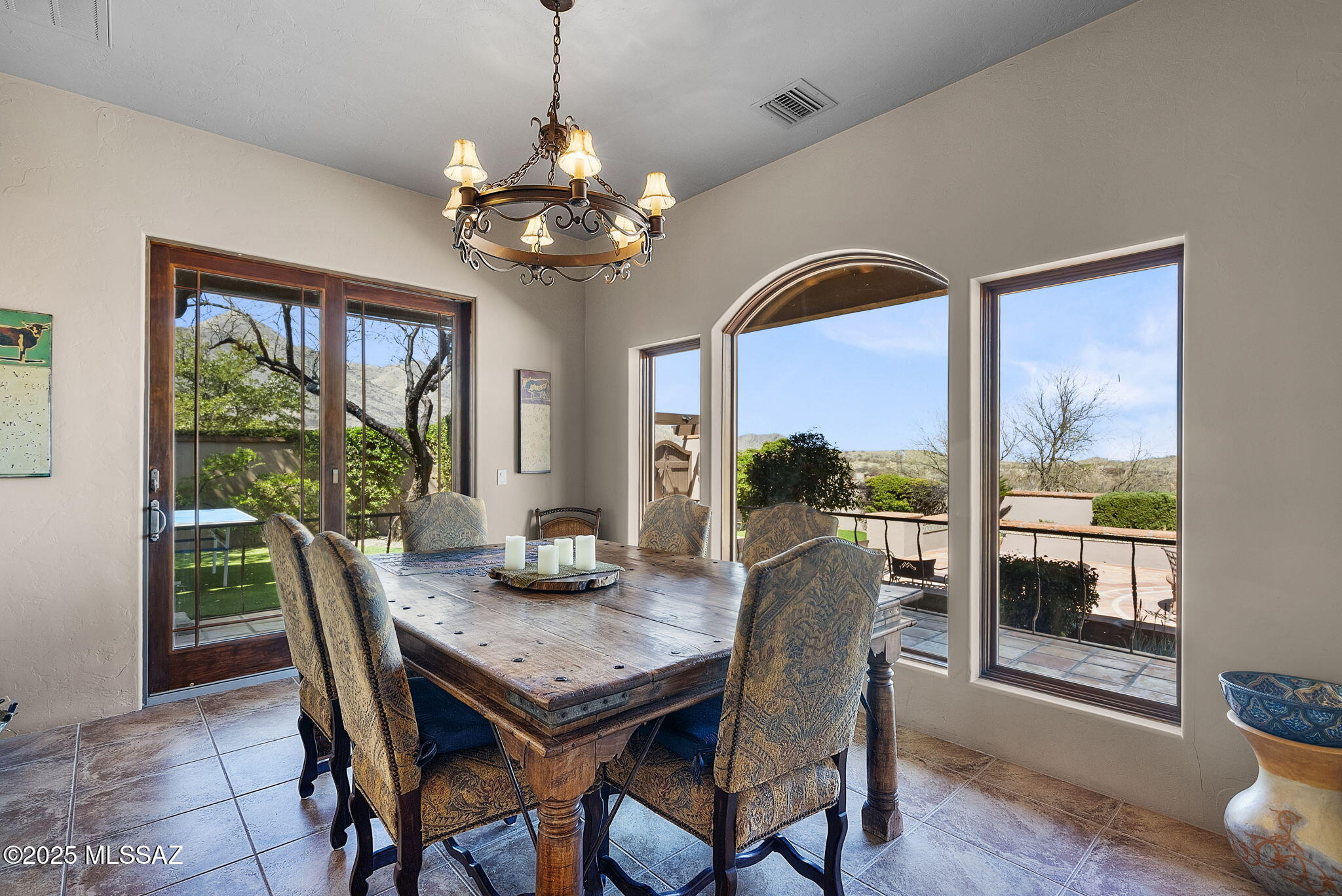 1265 Morning Star Drive Rio Rico, AZ 85648 - Photo 14 of 50 a view of a dining room with furniture wooden floor and chandelier