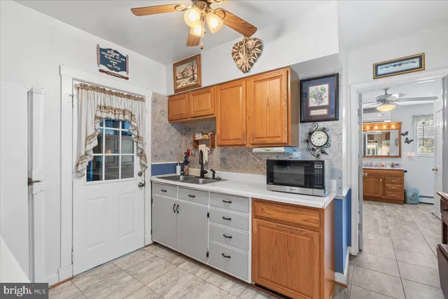 a kitchen with stainless steel appliances a stove microwave and cabinets