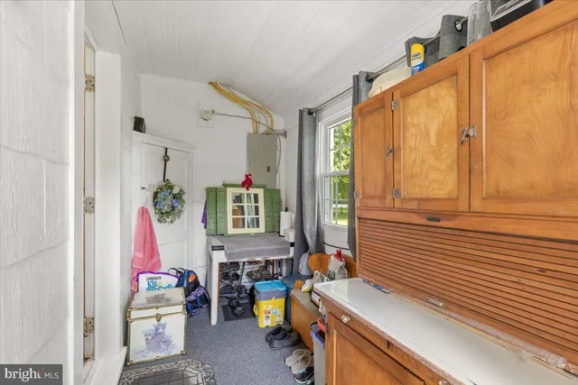 a view of a bedroom with furniture and windows