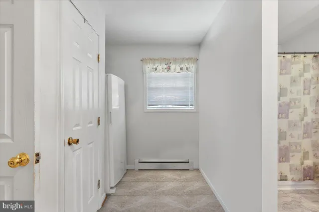 a bathroom with a toilet a sink and a mirror