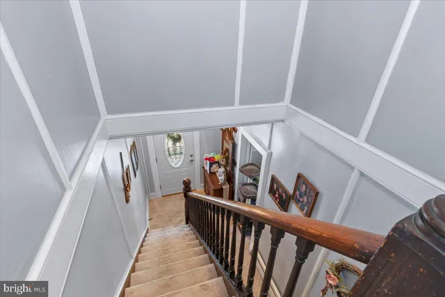 a bedroom with bed and a chandelier