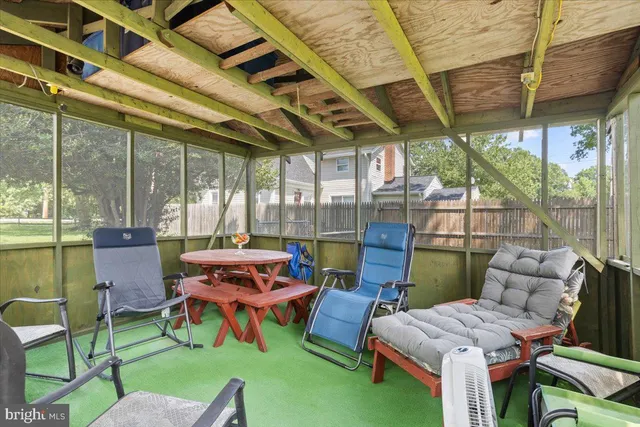 a patio with a patio table and chairs
