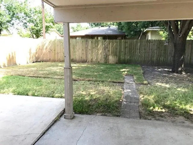 a backyard of a house with lots of green space