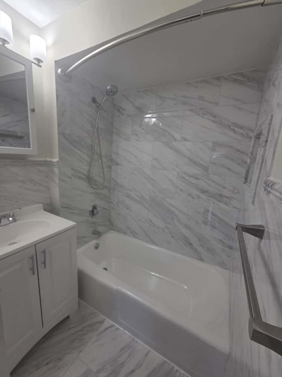 100 St Marys Street, Unit 1 Boston, MA 02215 - Photo 3 of 12 a bathroom with a bathtub and a sink