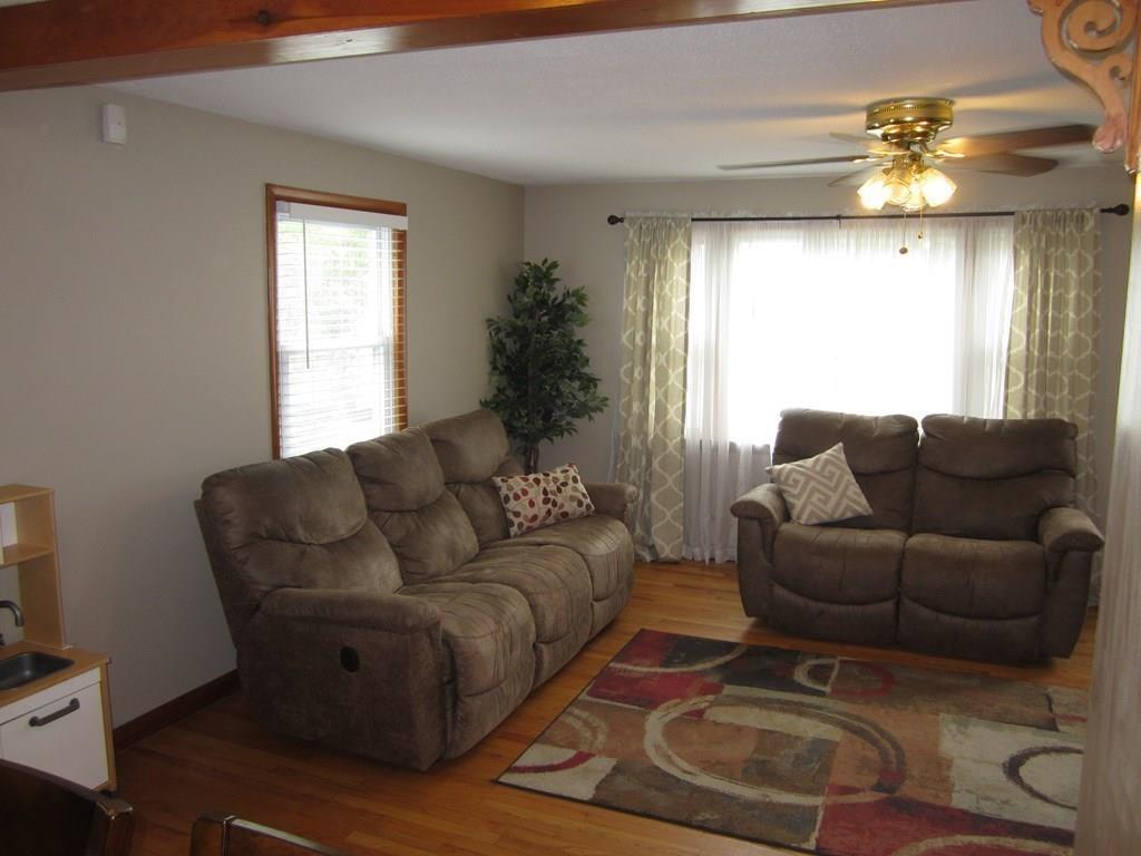 97 Fallston Street Springfield, MA 01119 - Photo 12 of 35 a living room with furniture and a chandelier
