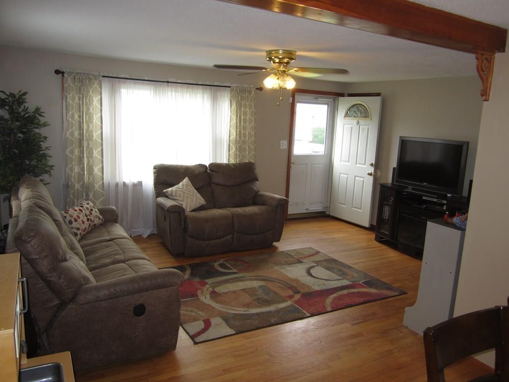97 Fallston Street Springfield, MA 01119 - Photo 13 of 35 a living room with furniture and a flat screen tv