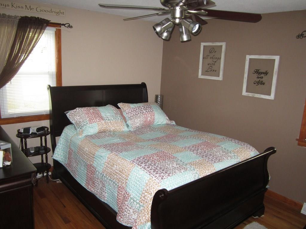 97 Fallston Street Springfield, MA 01119 - Photo 15 of 35 a bed sitting in a bedroom next to a window