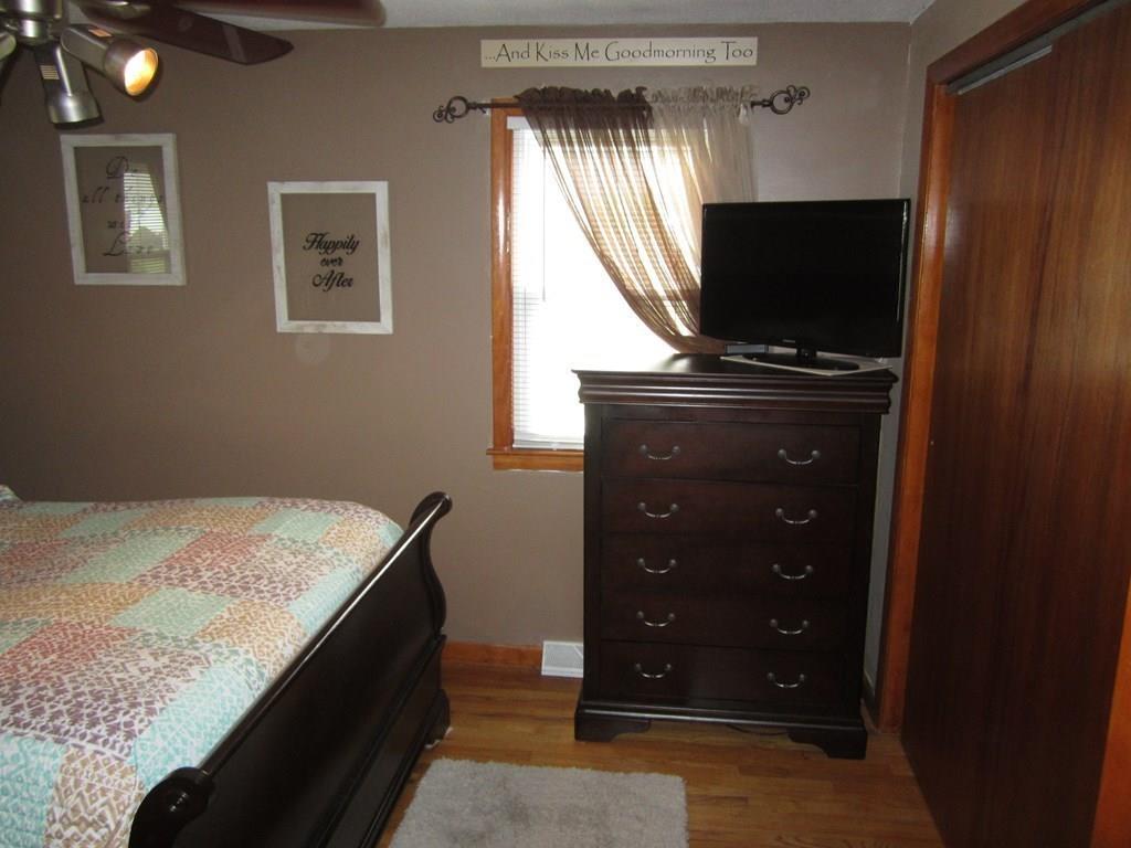 97 Fallston Street Springfield, MA 01119 - Photo 16 of 35 a living room with a bed and a flat screen tv