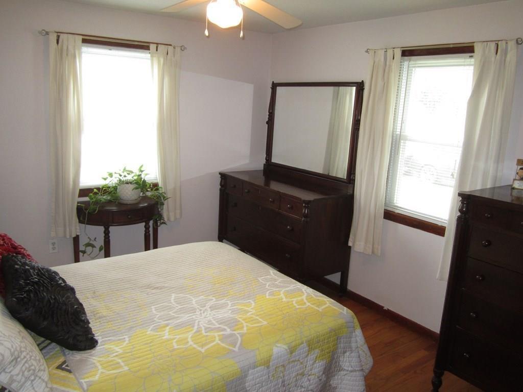 97 Fallston Street Springfield, MA 01119 - Photo 17 of 35 a bedroom with a bed and a mirror on dresser